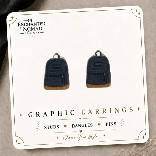 Backpack Stud Earrings on the tilted Enchanted Nomad Designs card