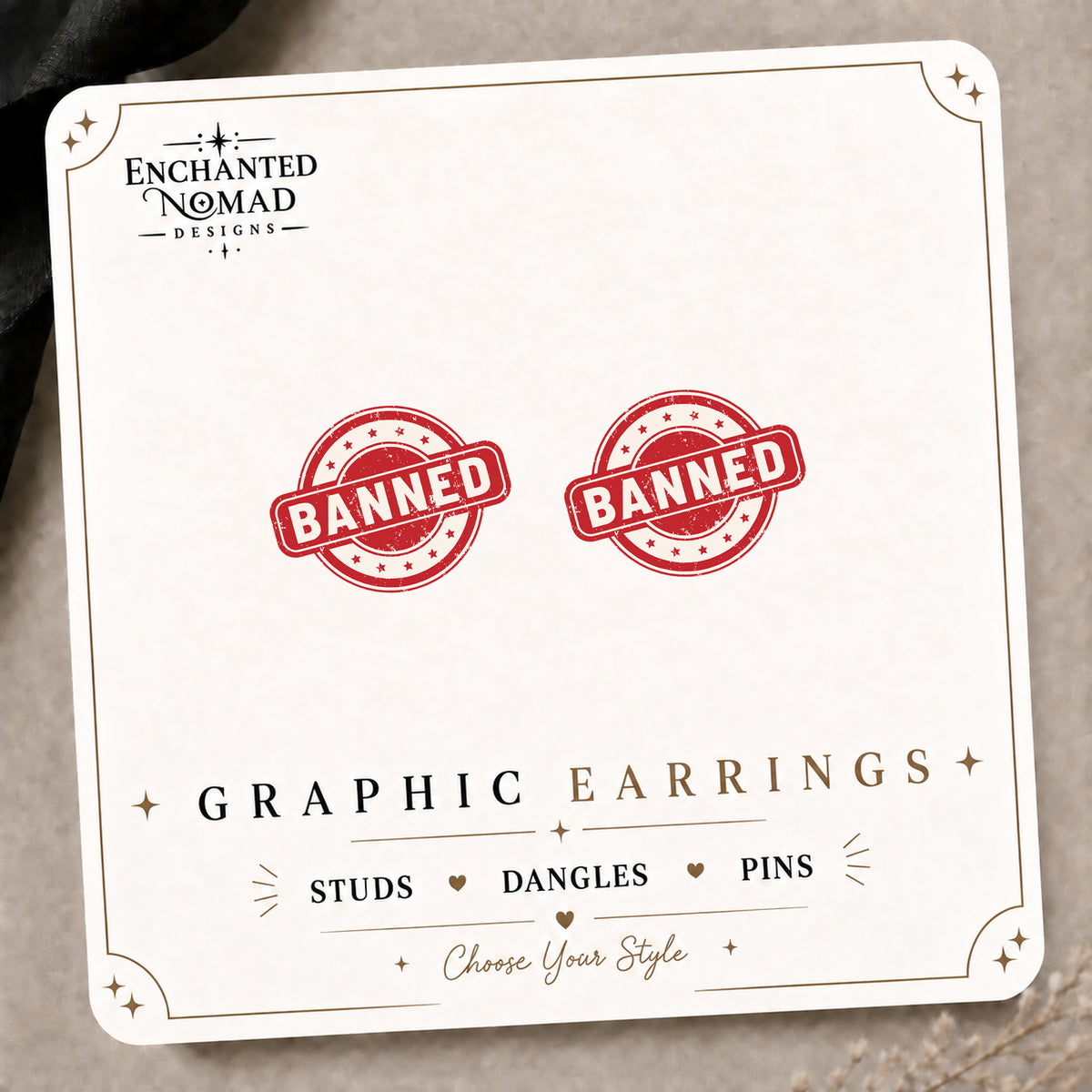Banned Stamp Stud Earrings on the tilted Enchanted Nomad Designs card