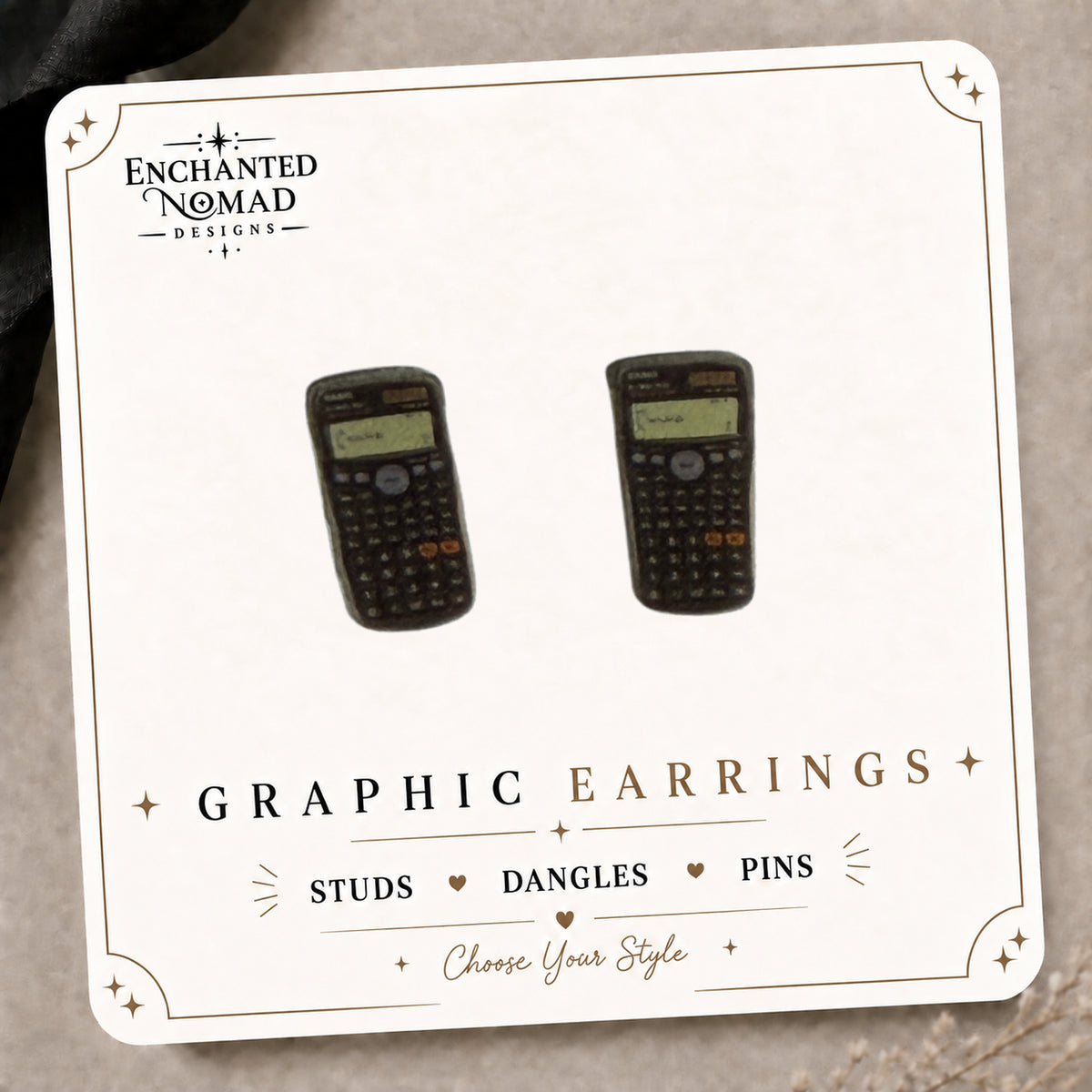 Calculator Stud Earrings on the tilted Enchanted Nomad Designs card