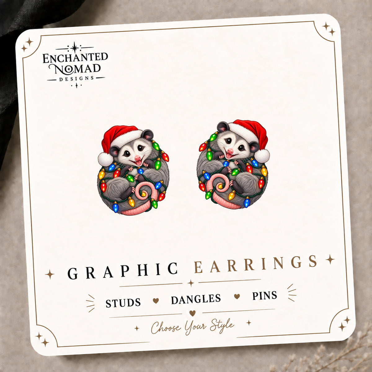 Christmas Lights Opossum Stud Earrings on the tilted Enchanted Nomad Designs card