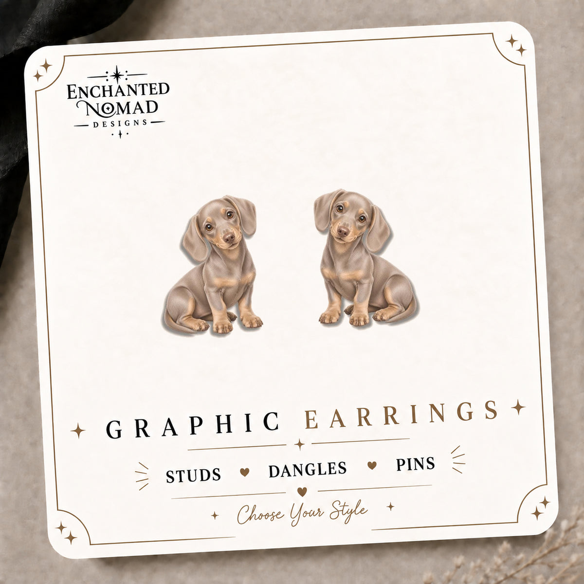 Cream Dachshund Puppy Stud Earrings on the tilted Enchanted Nomad Designs card
