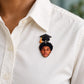 Custom graduation photo lapel pin worn on a shirt.