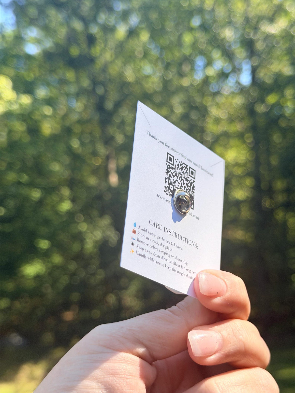Back of the graduation lapel pin display card showing the pin backing.
