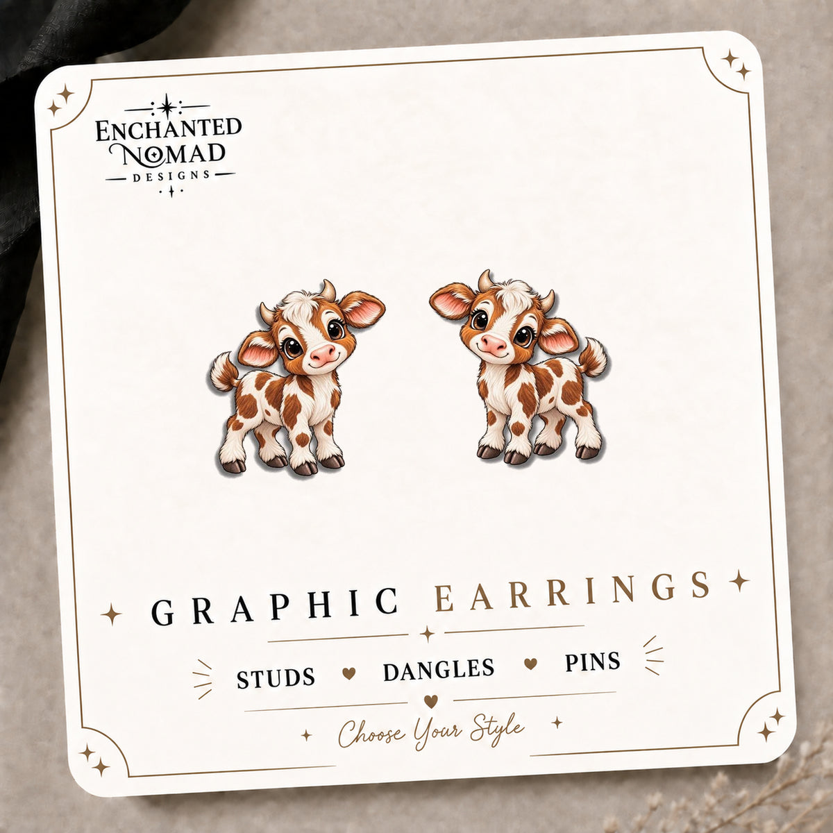Dairy Cow Stud Earrings on the tilted Enchanted Nomad Designs card