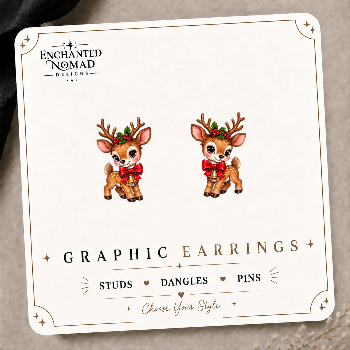 Festive Christmas Reindeer Stud Earrings on the tilted Enchanted Nomad Designs card