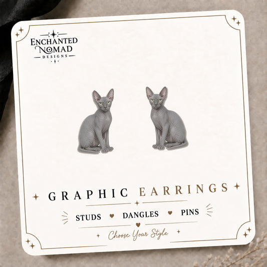 Gray Sphynx Cat Stud Earrings on the tilted Enchanted Nomad Designs card