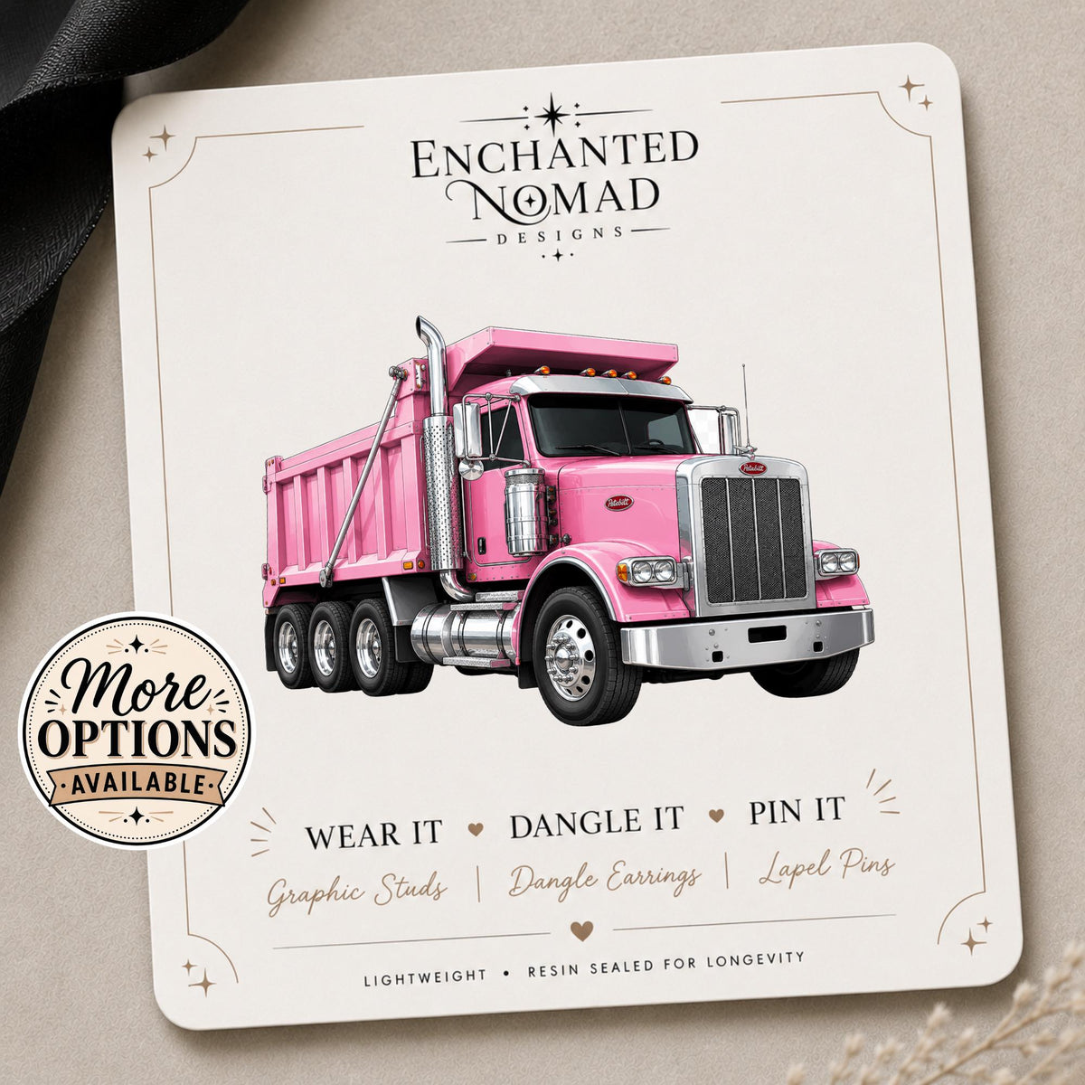 Pink Dump Truck Earrings & Pins on a branded display card