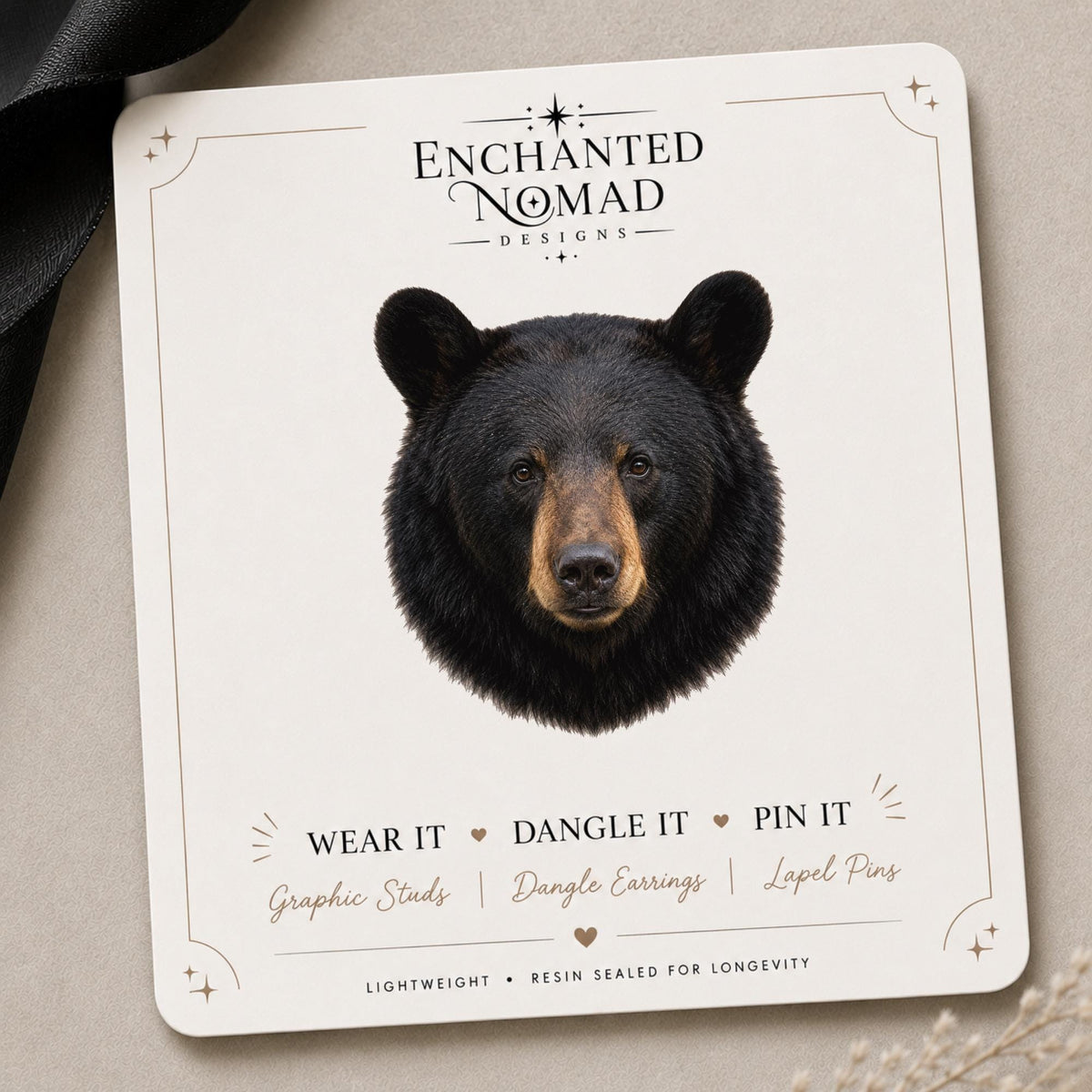 Black Bear Head Earrings & Pin on a branded display card