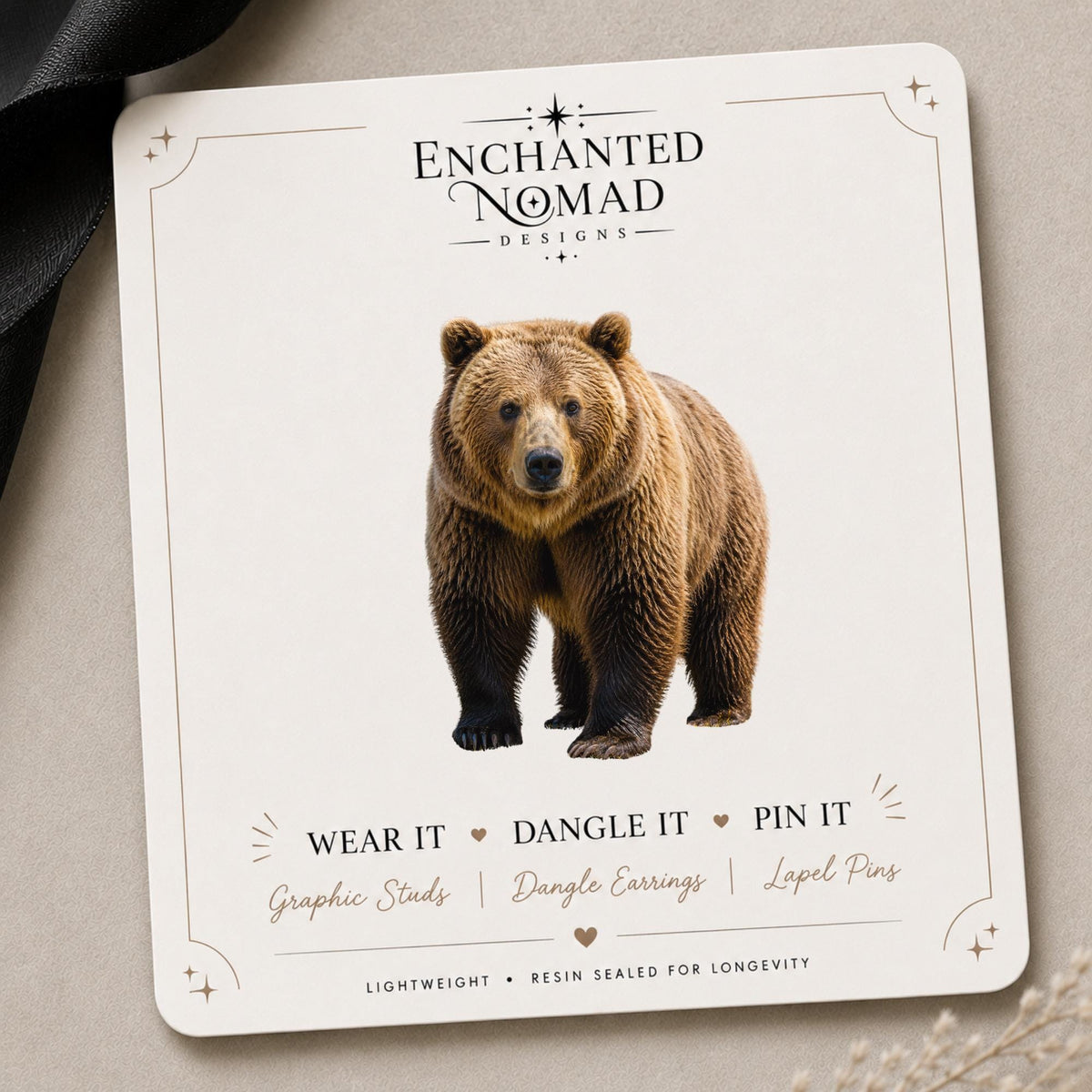 Grizzly Bear Earrings & Pins on a branded display card