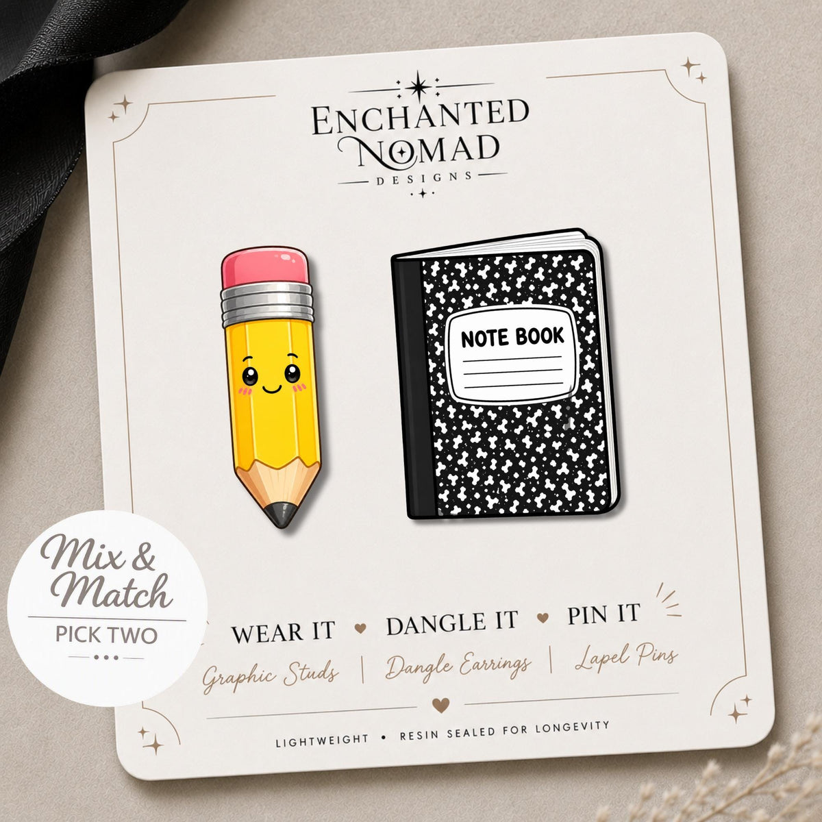 Kawaii Pencil and Notebook Earrings on a branded display card
