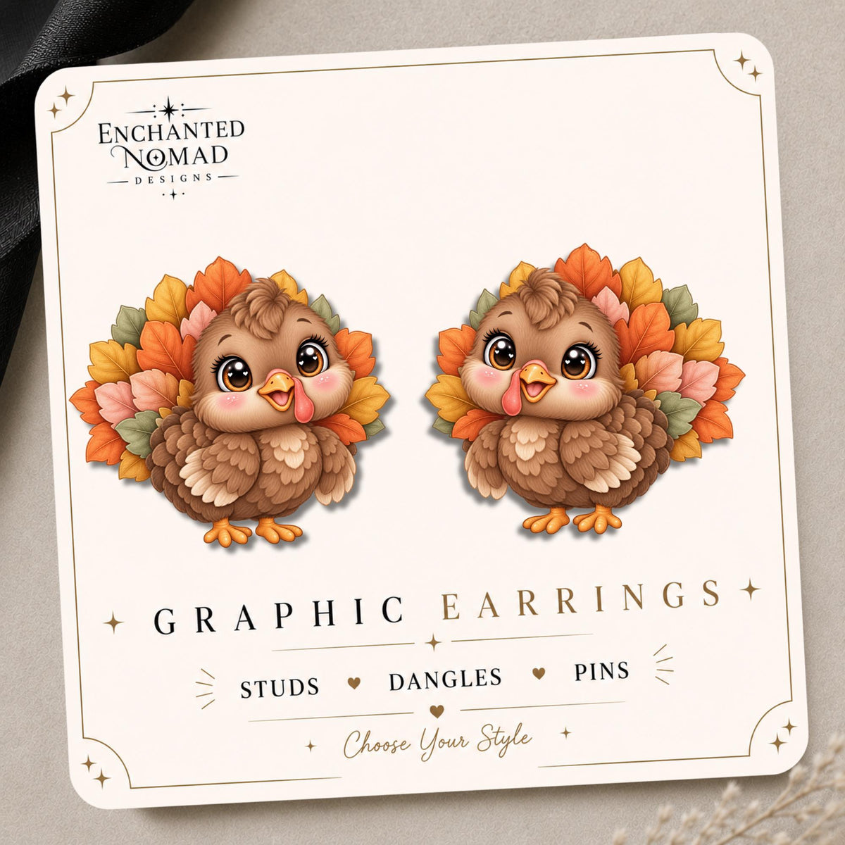 Fall Leaf Turkey earrings and pins on a tilted Enchanted Nomad Designs display card