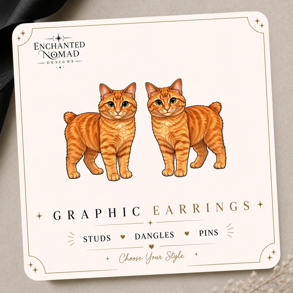 Orange Bobtail Cat Earrings & Pins on a display card