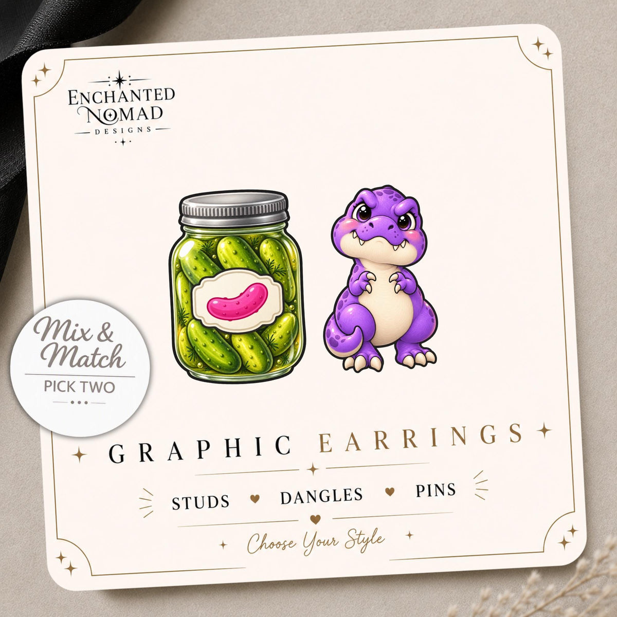 Pickle and Dinosaur Earrings & Pins on a display card