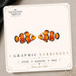 Clownfish graphic earrings and pins on a display card