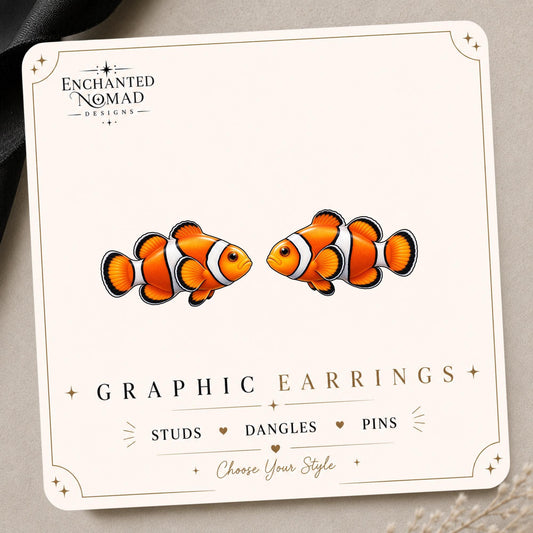 Clownfish graphic earrings and pins on a display card