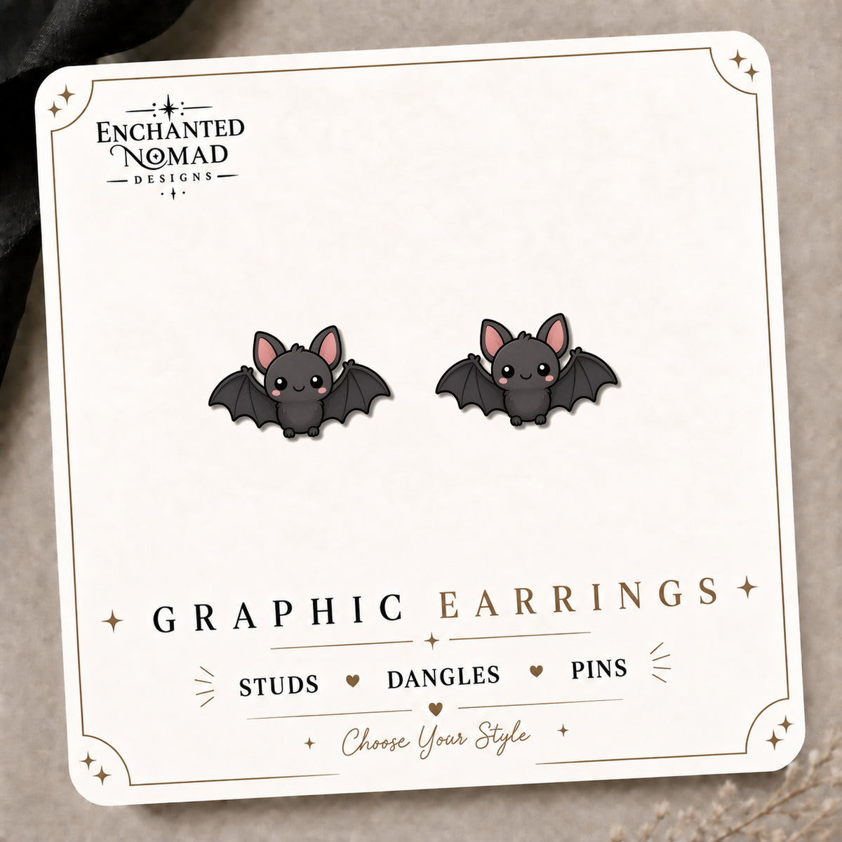 Kawaii Bat Earrings & Pins on the tilted Enchanted Nomad Designs card