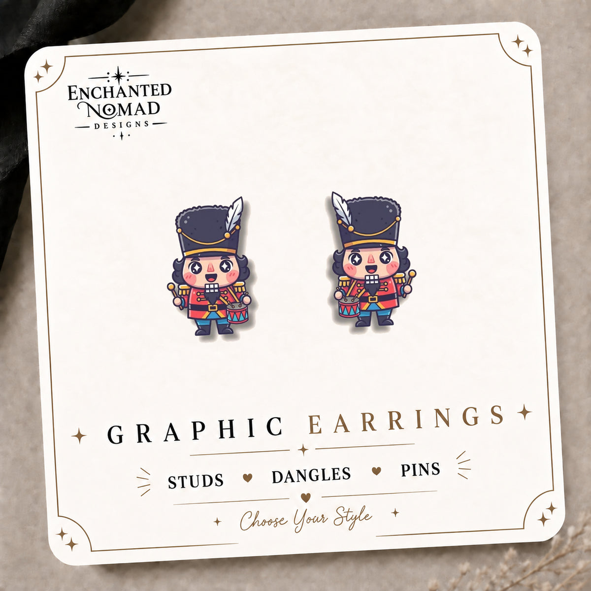 Nutcracker Soldier Stud Earrings on the tilted Enchanted Nomad Designs card