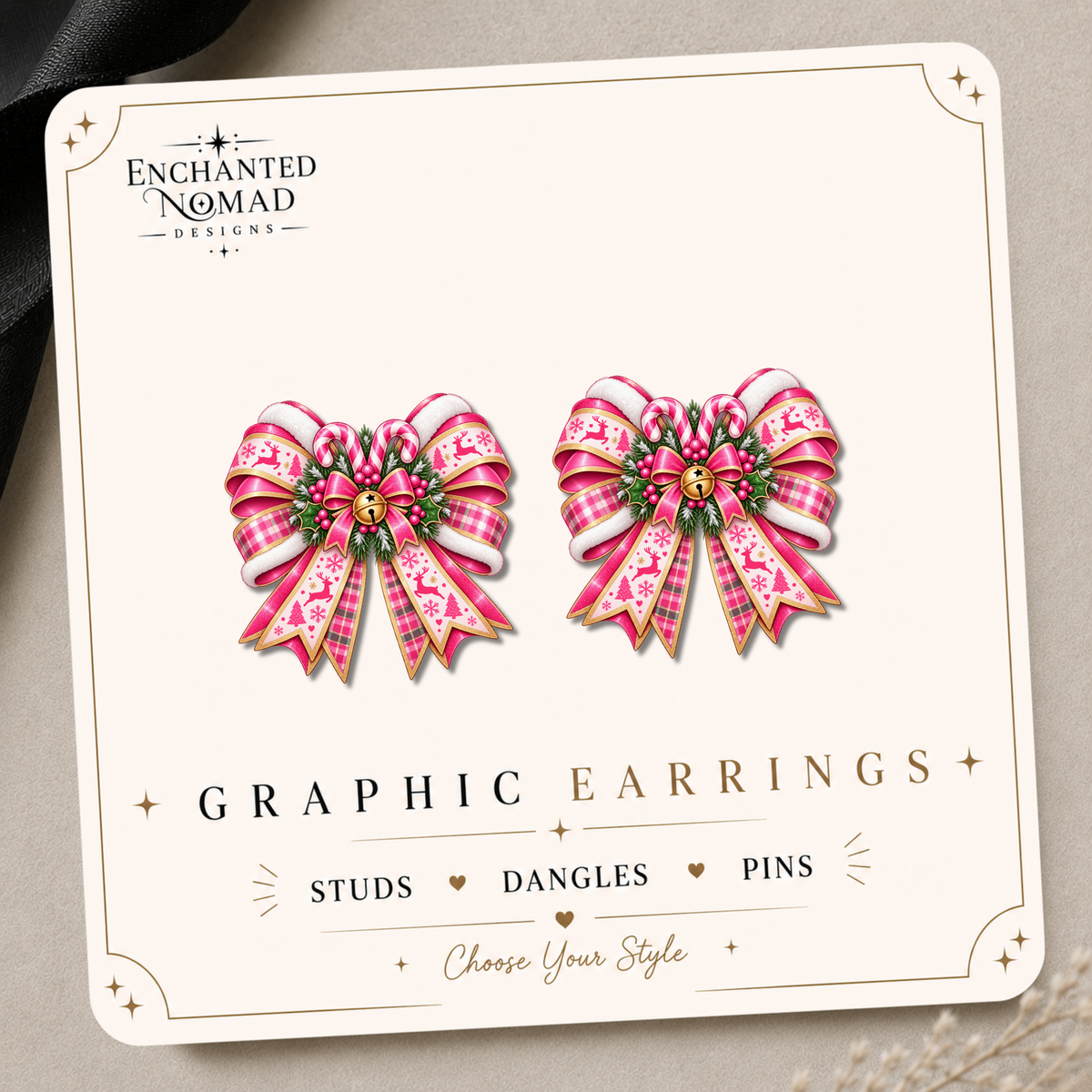 Pink Christmas bow graphic earrings featuring pink plaid, candy canes, festive ribbon, greenery and a gold bell on an Enchanted Nomad Designs display card.