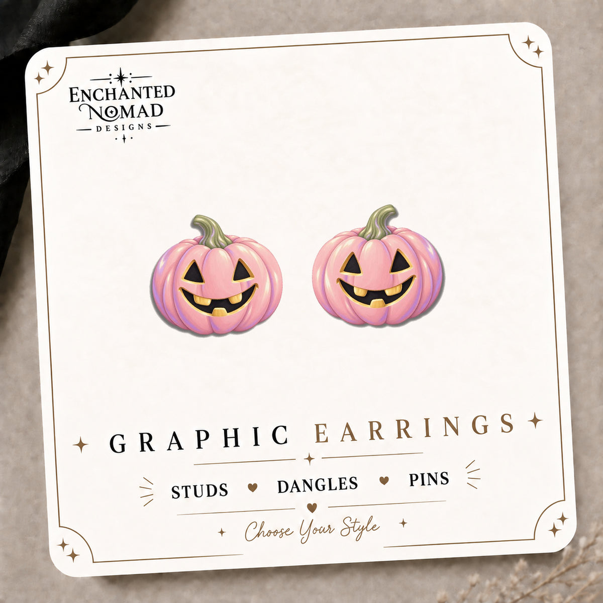 Pink Jack-o-Lantern Stud Earrings on the tilted Enchanted Nomad Designs card