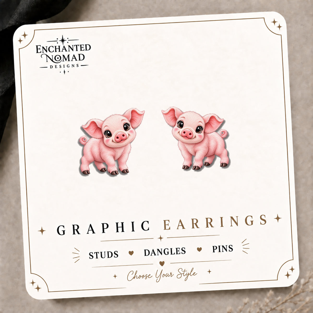 Pink Piglet Stud Earrings on the tilted Enchanted Nomad Designs card