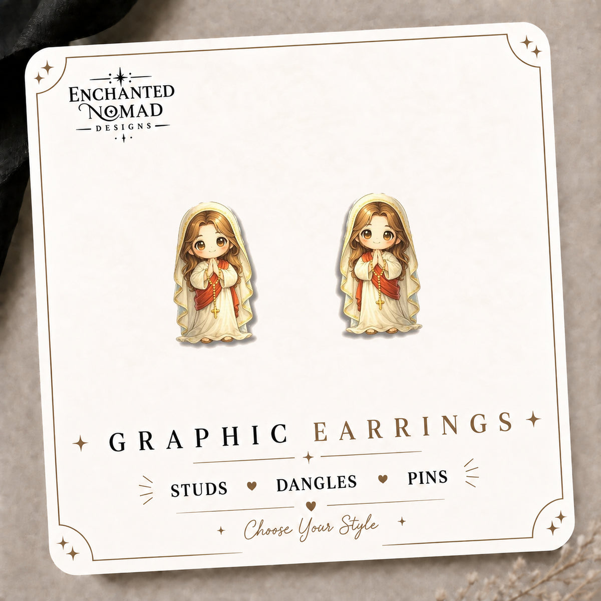 Praying Mary Stud Earrings on the tilted Enchanted Nomad Designs card