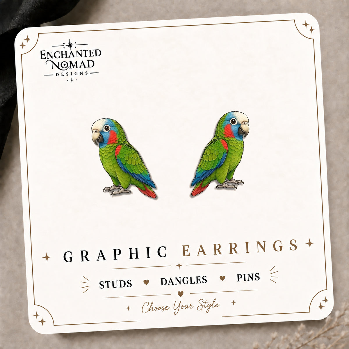 Puerto Rican Parrot Stud Earrings on the tilted Enchanted Nomad Designs card