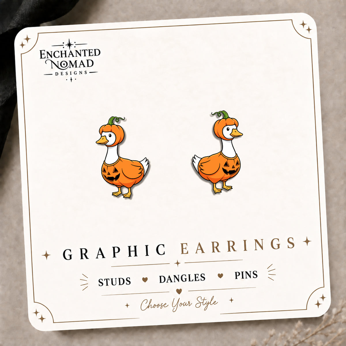 Pumpkin Goose Stud Earrings on the tilted Enchanted Nomad Designs card