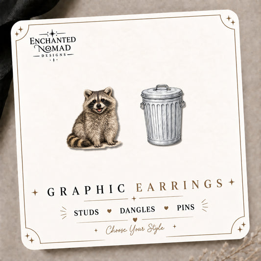 Raccoon & Trash Can Stud Earrings on the tilted Enchanted Nomad Designs card