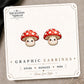 Red Toadstool Mushroom Stud Earrings on the tilted Enchanted Nomad Designs card