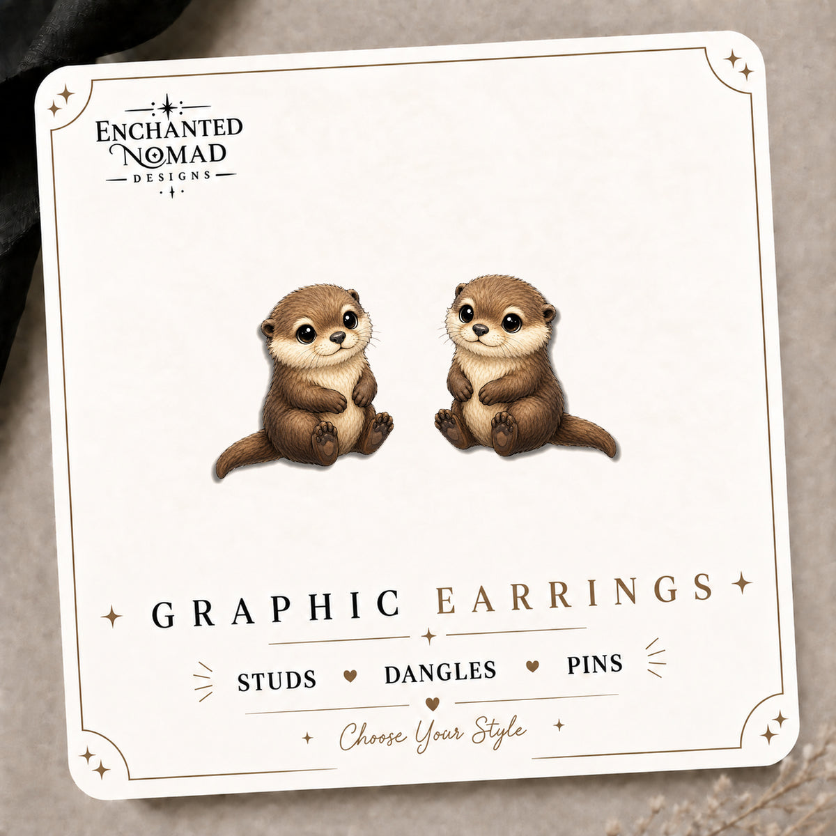 River Otter Stud Earrings on the tilted Enchanted Nomad Designs card