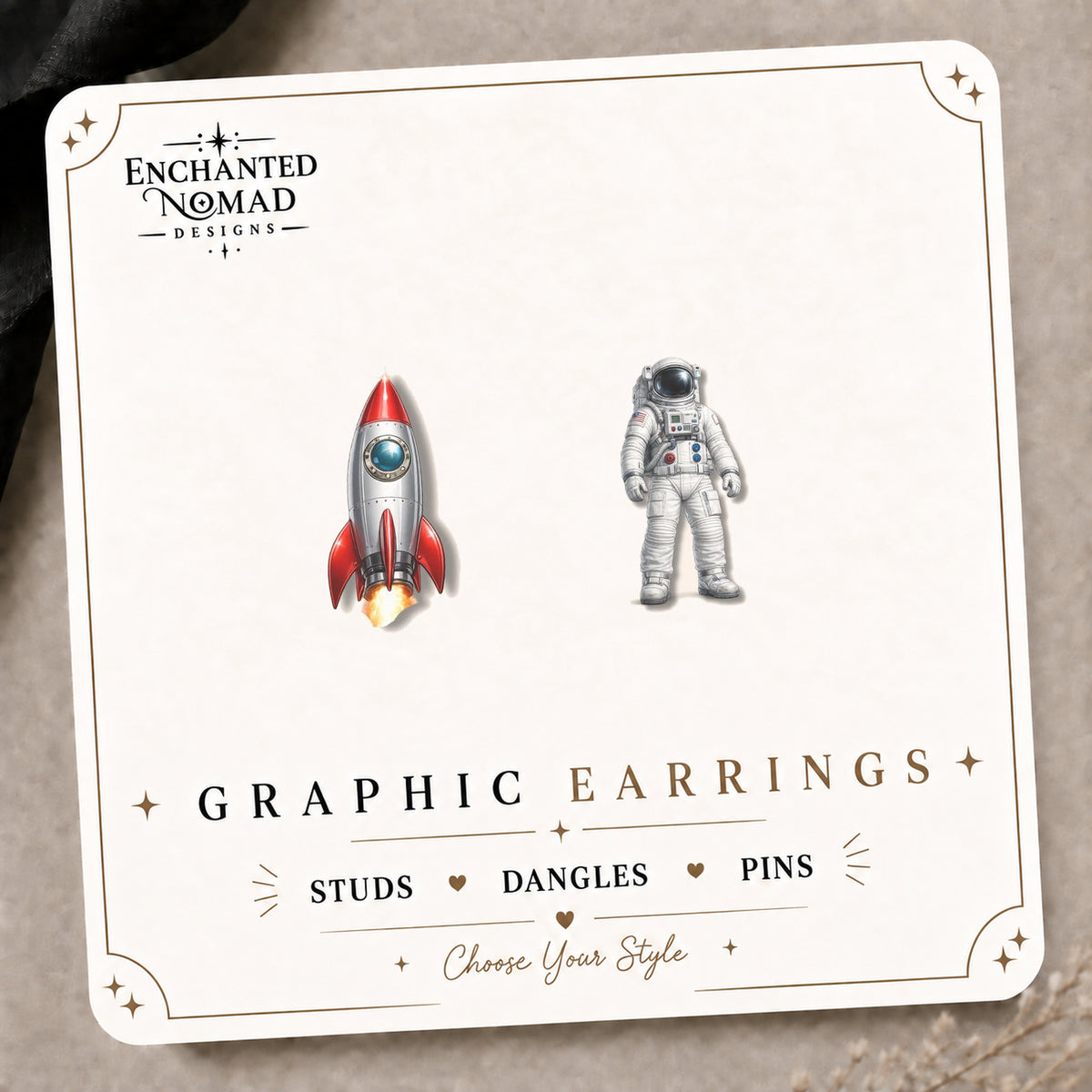 Rocket and Astronaut Stud Earrings on the tilted Enchanted Nomad Designs card