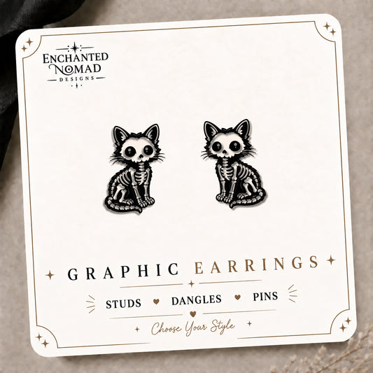 Skeleton Cat Stud Earrings on the tilted Enchanted Nomad Designs card
