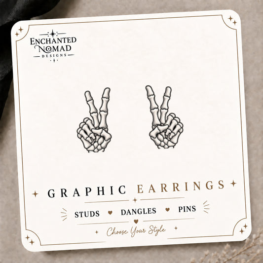 Skeleton Peace Sign Stud Earrings on the tilted Enchanted Nomad Designs card