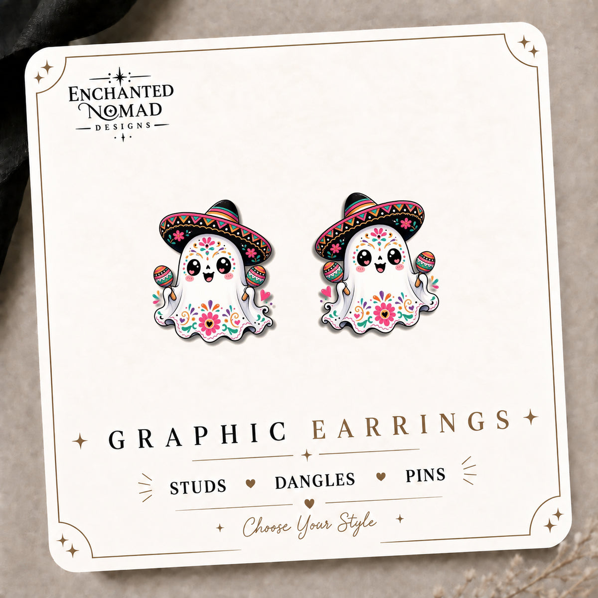 Sugar Skull Ghost Stud Earrings on the tilted Enchanted Nomad Designs card