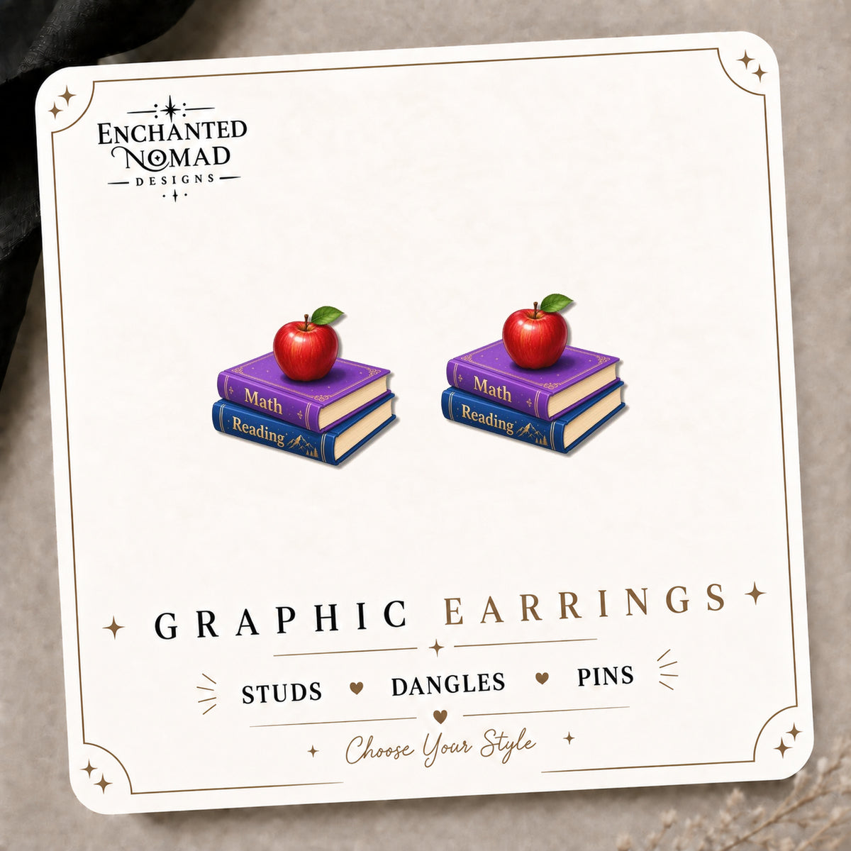 Teacher Book and Apple Stud Earrings on the tilted Enchanted Nomad Designs card