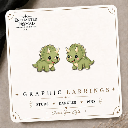 Triceratops Stud Earrings on the tilted Enchanted Nomad Designs card