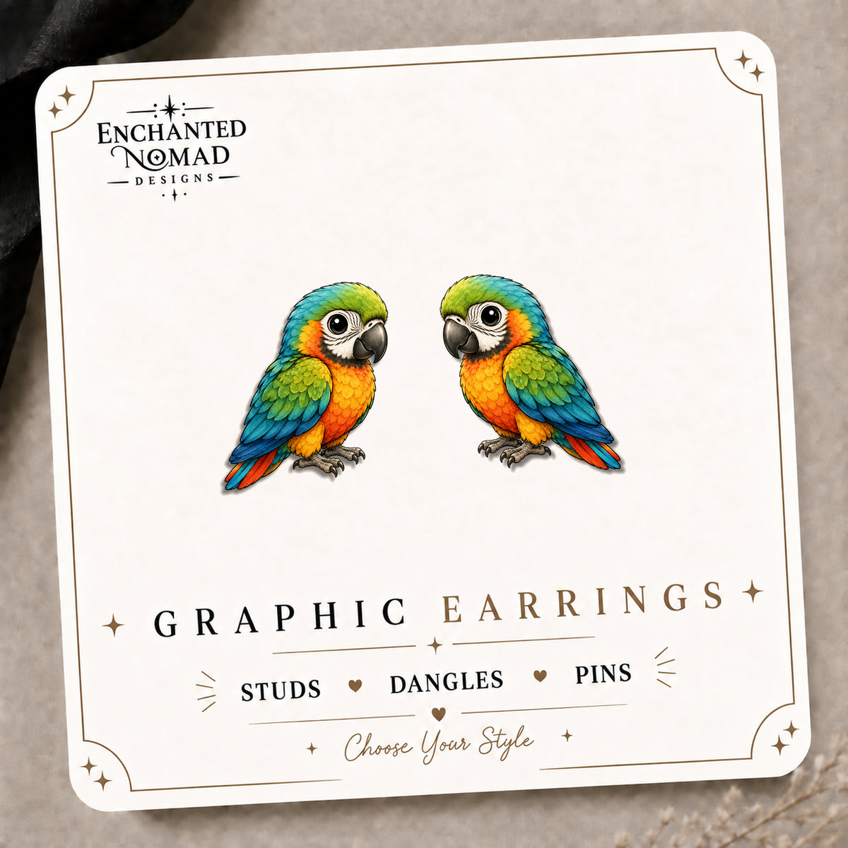 Vibrant Parrot Stud Earrings on the tilted Enchanted Nomad Designs card