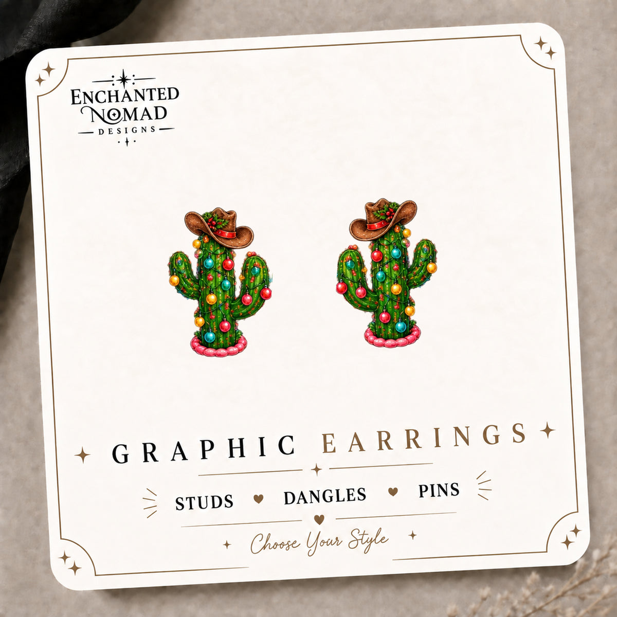 Western Christmas Cactus Stud Earrings on the tilted Enchanted Nomad Designs card