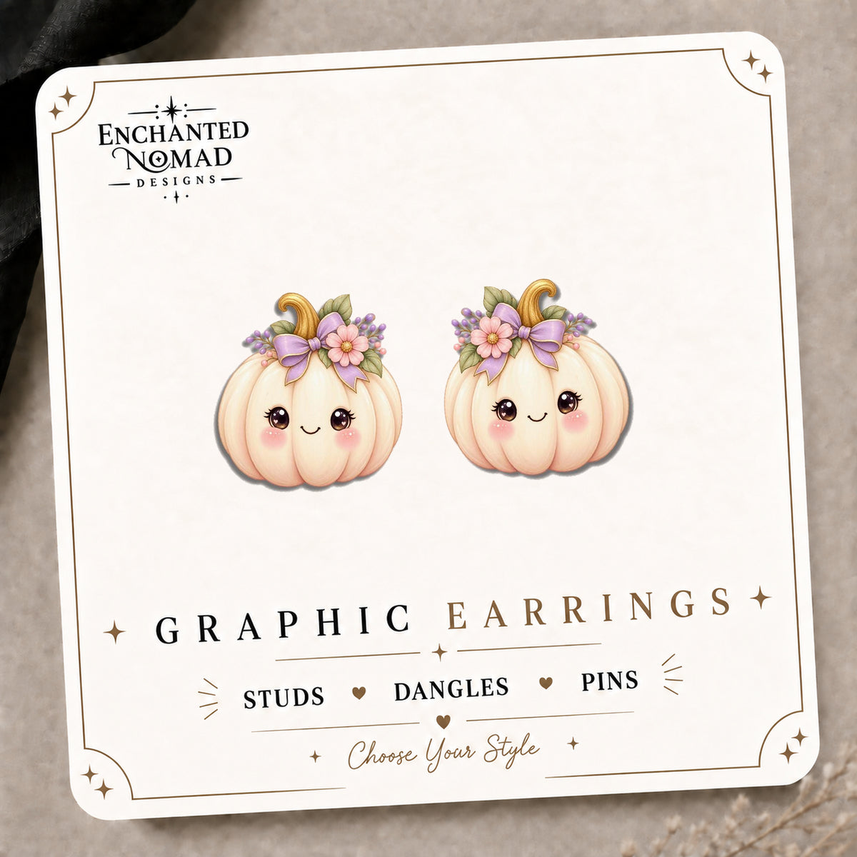 White Floral Pumpkin Stud Earrings on the tilted Enchanted Nomad Designs card